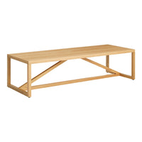 Natural wood coffee table with a sleek, modern design and a light beige finish.