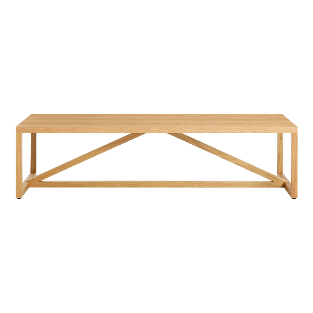 Light natural wood coffee table with a simple, sleek design and cross-patterned support structure.