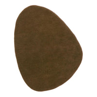Brown organic-shaped mat with a soft texture, ideal for adding warmth to any space.