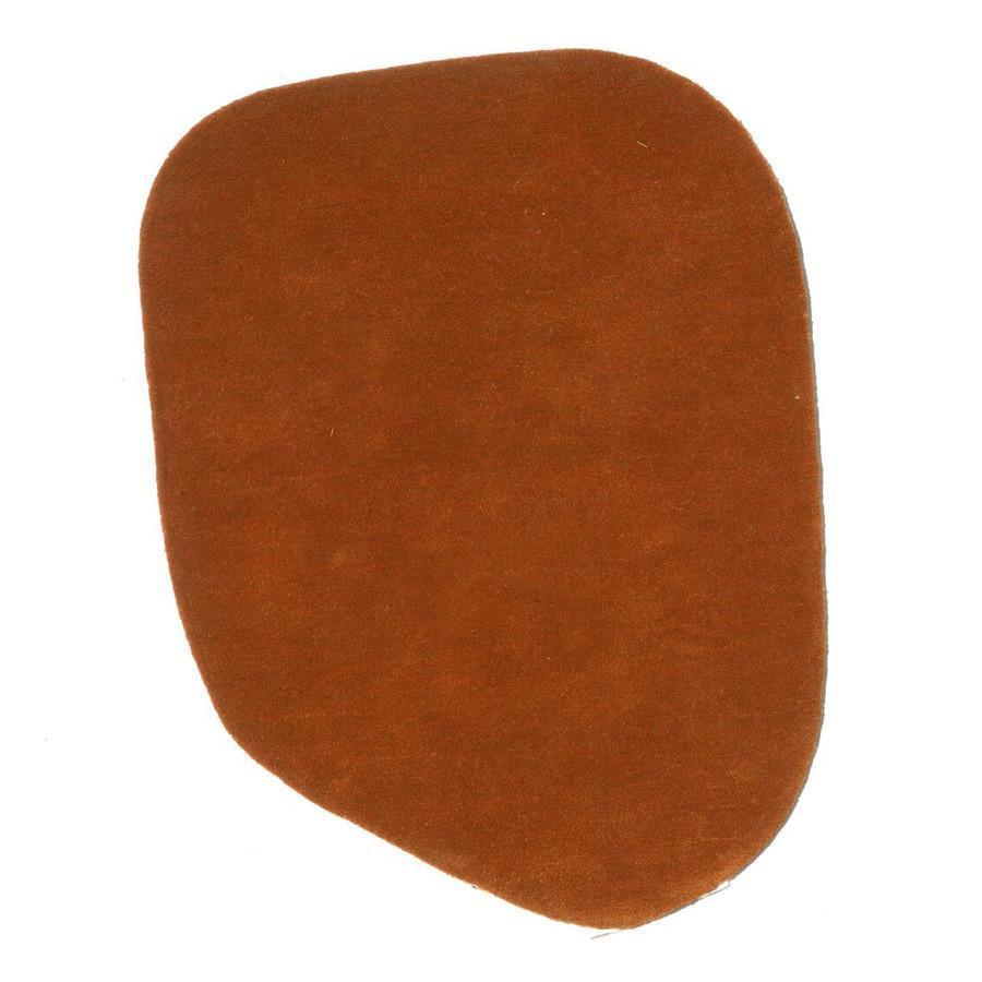 Soft, suede-like, warm brown color with a smooth texture and irregular shape. Perfect for stylish decor accents.