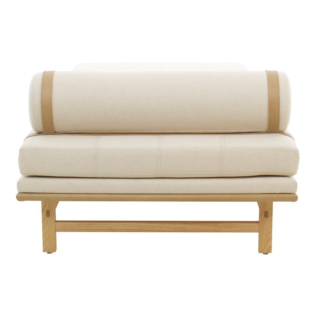Cream upholstered two-seater sofa with natural wood base and subtle contrasting straps. Modern minimalist design.