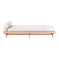 Light beige chaise lounge with a simple design, featuring a cylindrical pillow and natural wood frame.