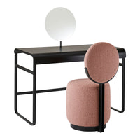 Stylish black desk with round mirror and soft pink upholstered chair featuring a unique circular back design.