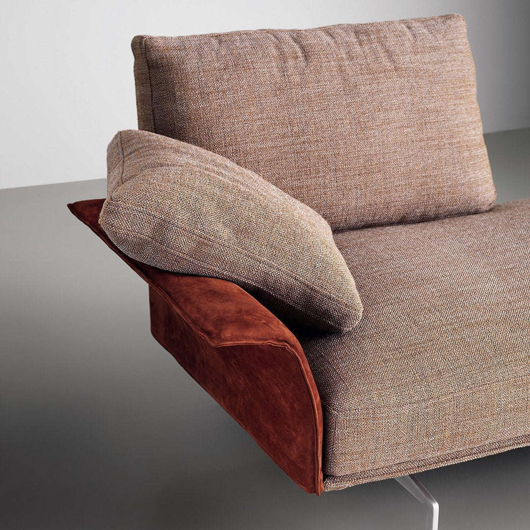 Brown textured upholstery with a rust-colored suede accent cushion. Contemporary and cozy design.