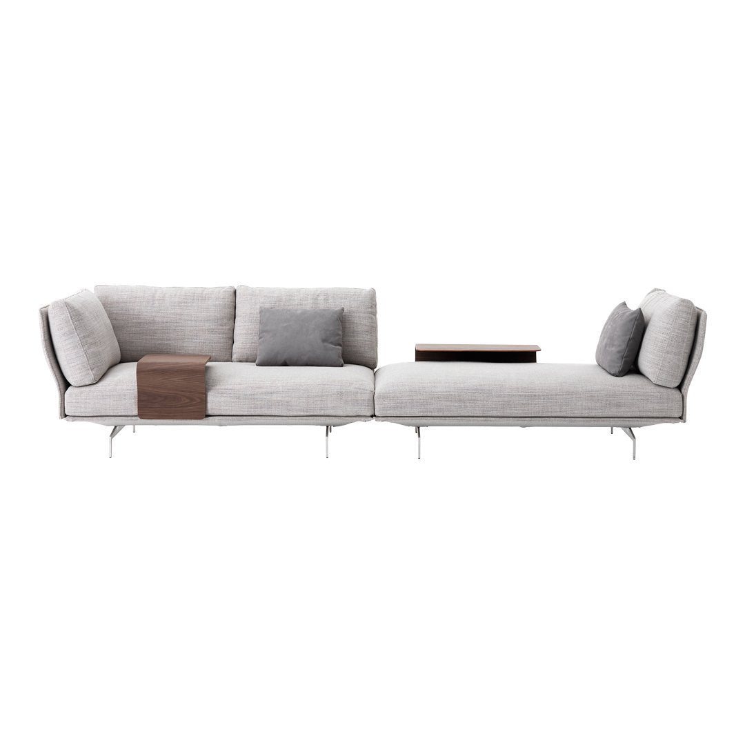 Modern light gray sectional sofa with sleek lines, plush cushions, and minimalistic wooden accent table.