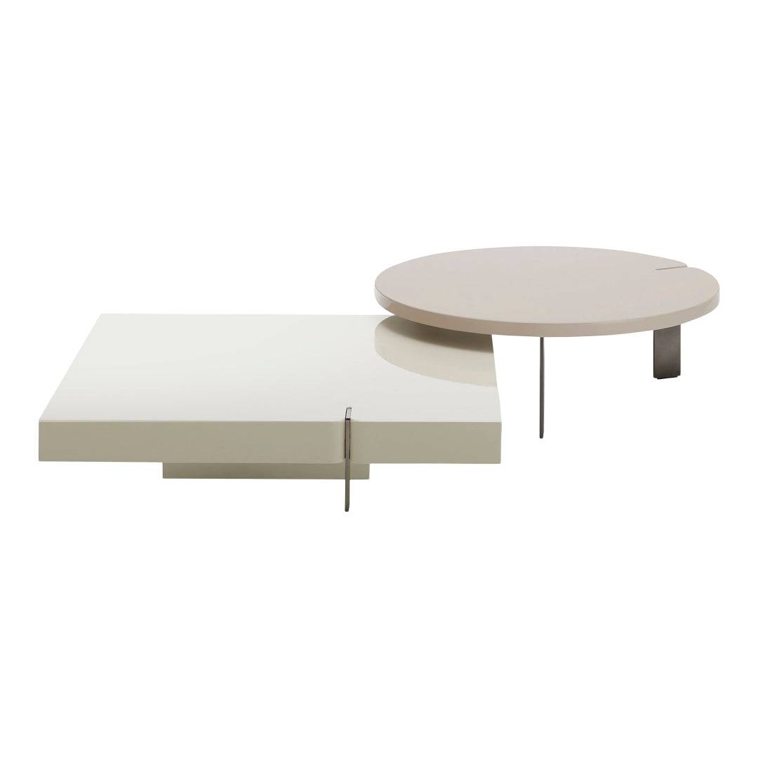 Modern coffee tables in glossy white and soft beige, featuring sleek geometric shapes and minimalistic design.