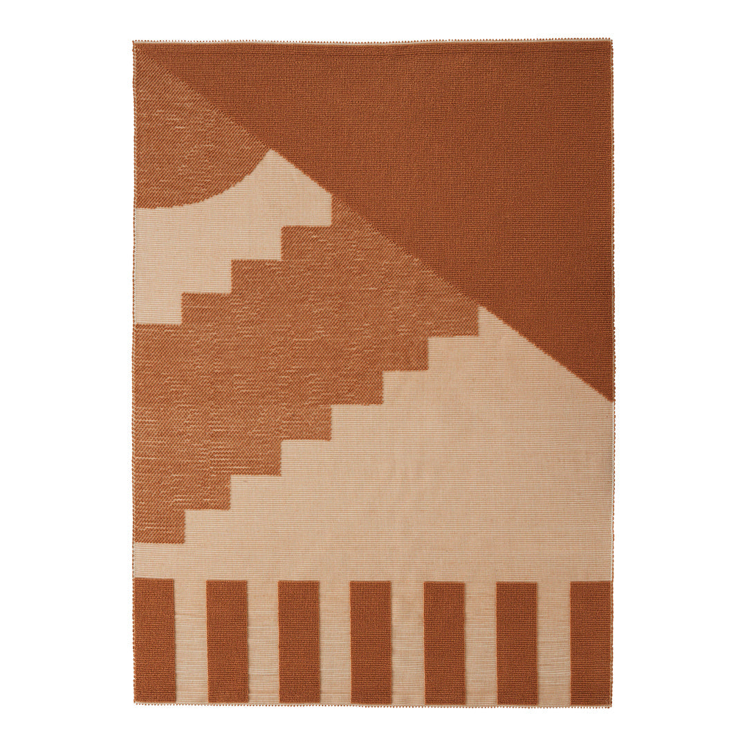 Geometric rug featuring warm terracotta and cream tones with soft patterns and stripes. Perfect for modern decor.