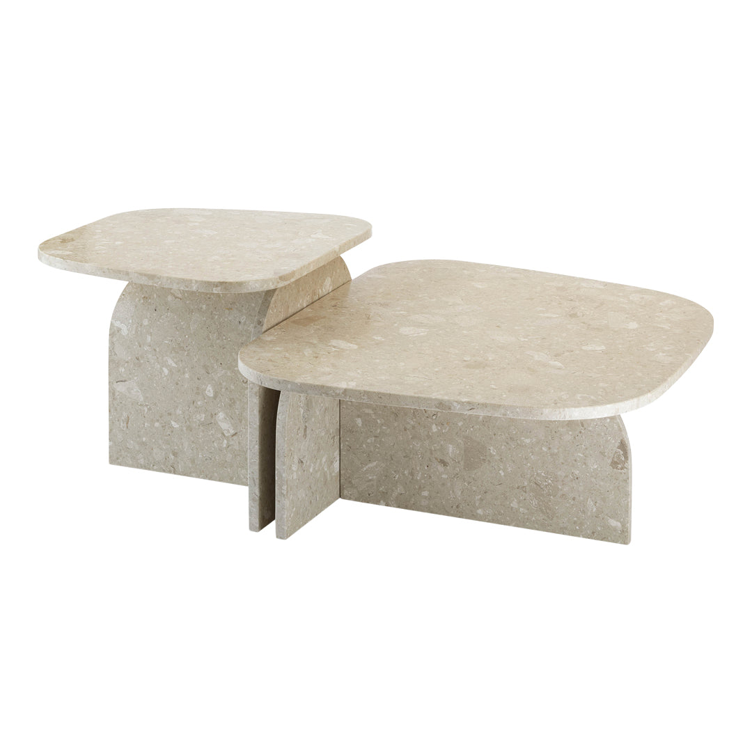 Light beige stone coffee tables with subtle speckled patterns and smooth, rounded edges. Modern minimalist design.