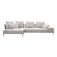 Luxury beige sectional sofa with white accent pillows and a minimalist design, perfect for modern interiors.