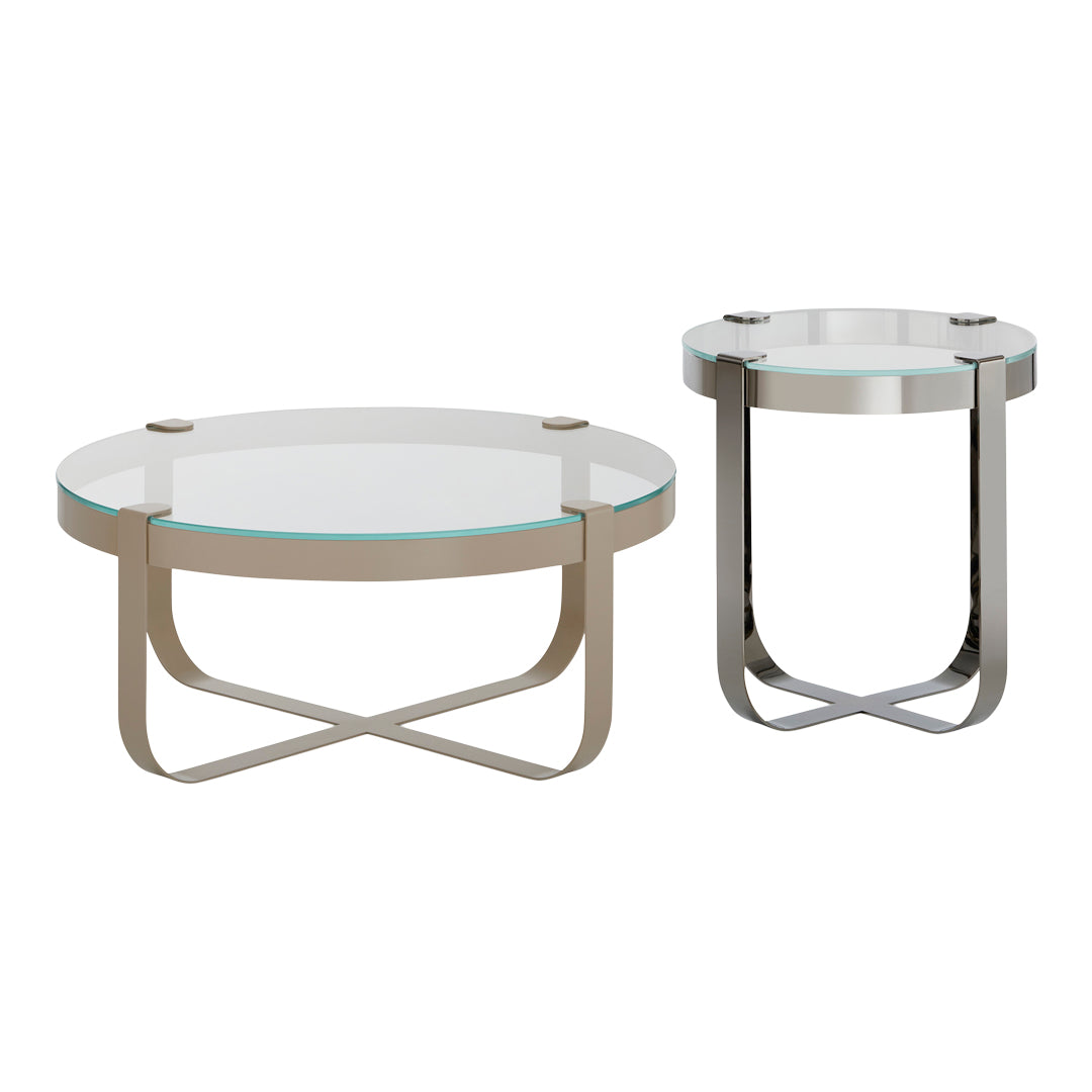"Modern coffee and side tables with sleek metal frames and glass tops in clear and silver hues."