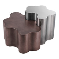 Two modern decorative tables: one in rich brown and the other in sleek silver, with organic, wavy shapes.