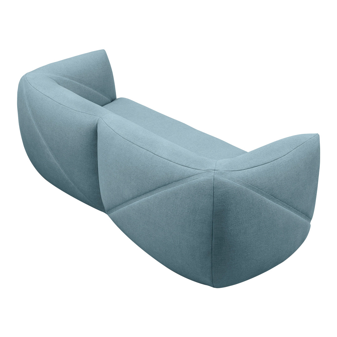 Stylish two-tone blue sofa with geometric patterns, featuring soft curves and textured fabric design.