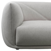 Light gray sofa with a sleek, modern design featuring subtle curved lines and a textured fabric pattern.
