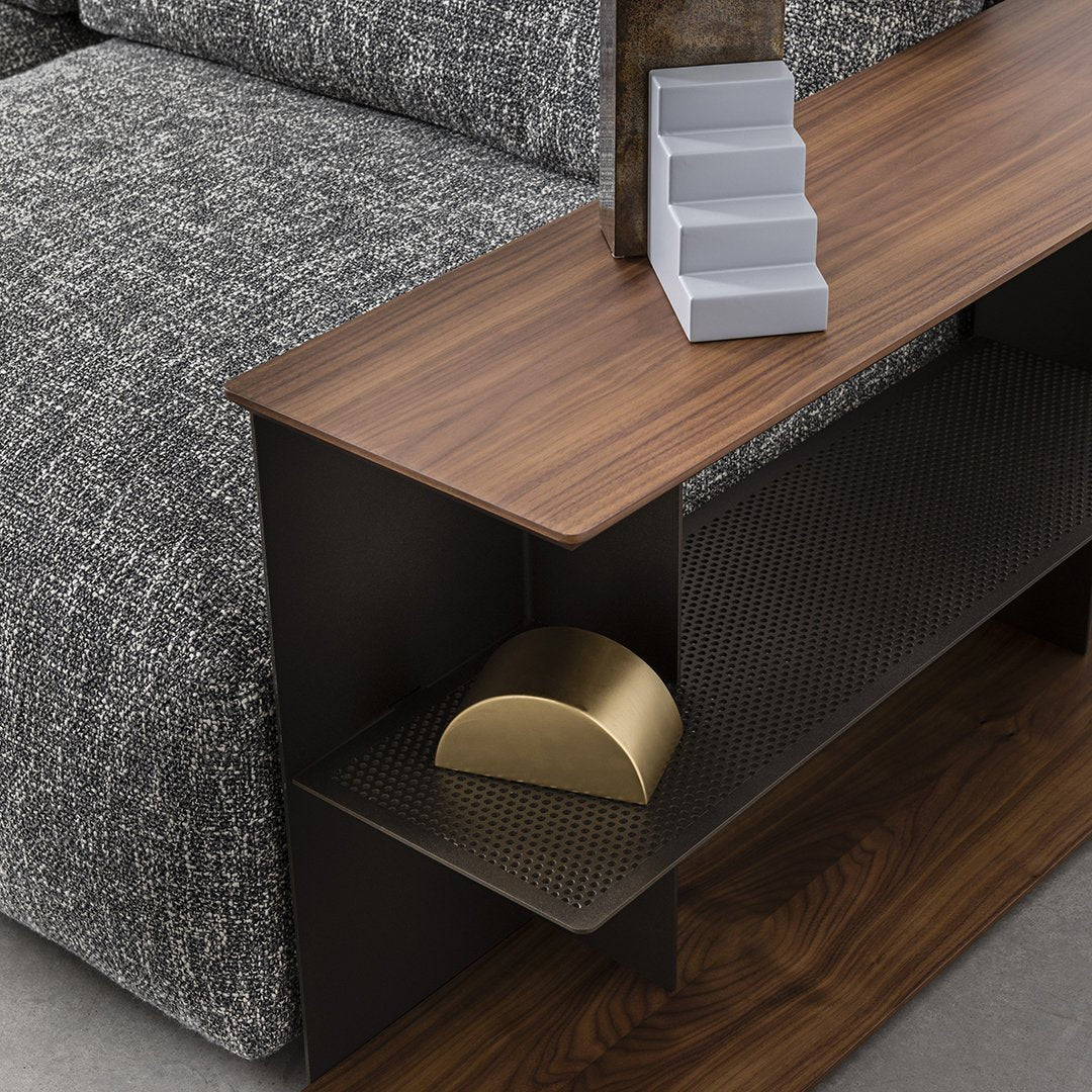 Wooden tabletop with a dark metal base, featuring grey textured upholstery and gold and white decorative elements.