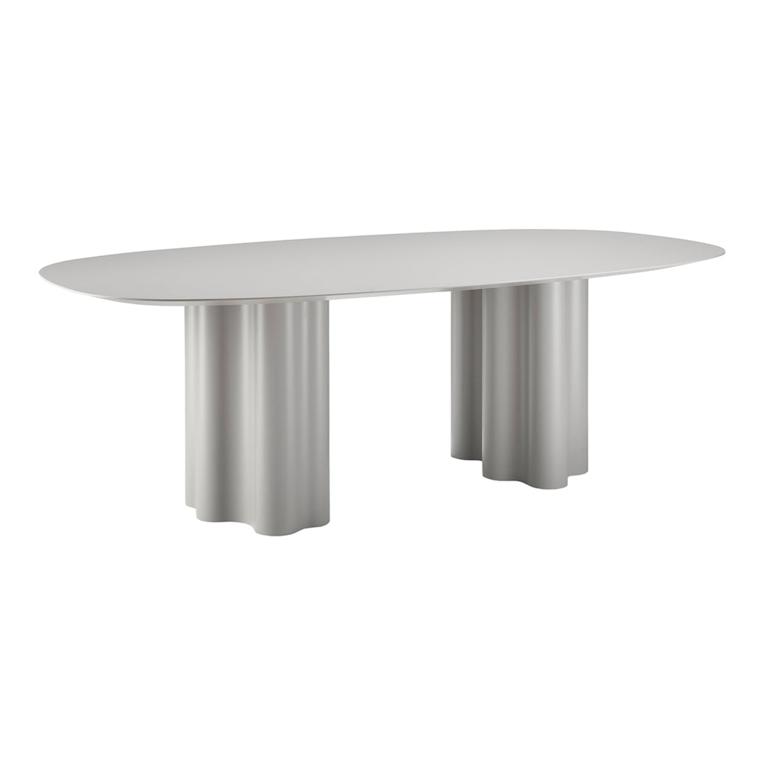 Light gray oval dining table with fluted column legs, featuring a smooth finish and minimalist design.