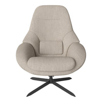 Beige fabric armchair with minimalist design, smooth contours, and a black metal base. Ideal for modern interiors.