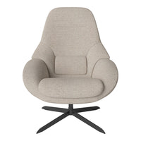 Light beige upholstered chair with smooth, contoured shape and a dark metal base, perfect for modern decor.