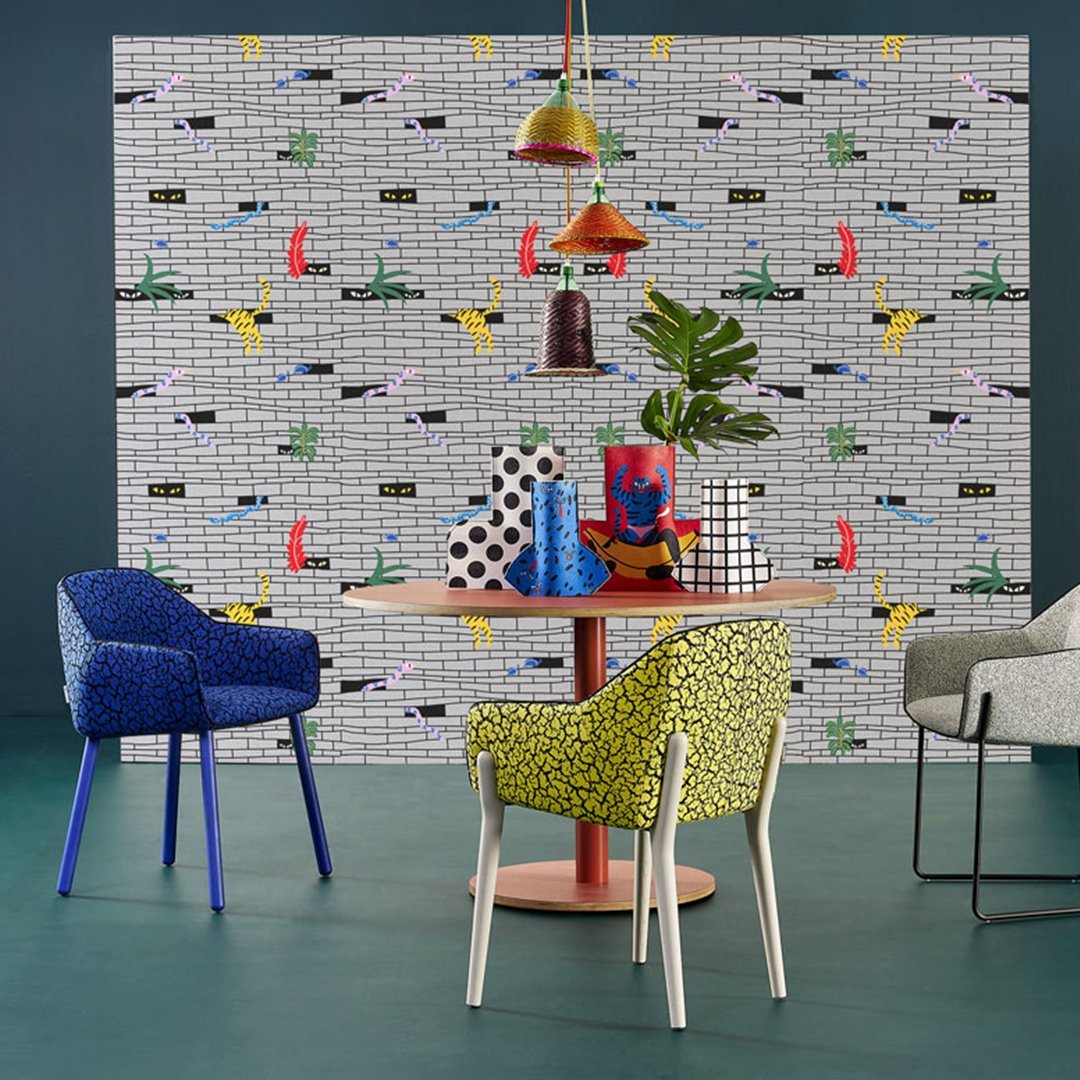 Colorful wallpaper with bold patterns featuring red boats, yellow birds, and black and white geometric designs.