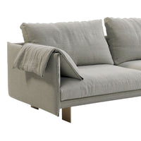 Light gray sofa with soft, textured fabric and simple, modern design. Features plush cushions and a minimalist aesthetic.