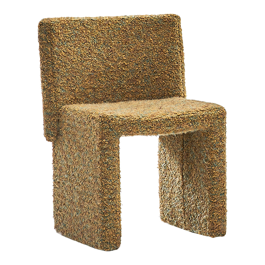 Textured chair in earthy brown tones with subtle green highlights, featuring a unique, woven pattern.