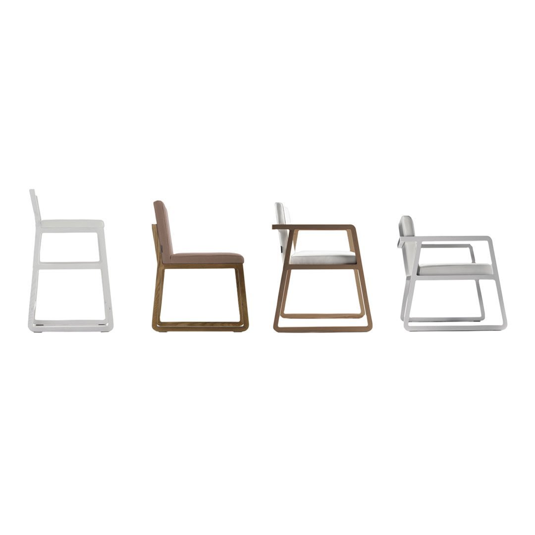 Set of four modern chairs in white, beige, and brown with sleek minimalistic design and contrasting metal frames.