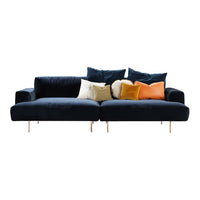 Stylish navy blue sofa with mixed colorful cushions: cream, yellow, orange, and textured patterns. Perfect for modern decor.