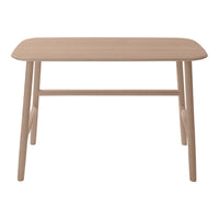 Natural wood dining table with a smooth, light beige finish and minimalist design, perfect for modern interiors.