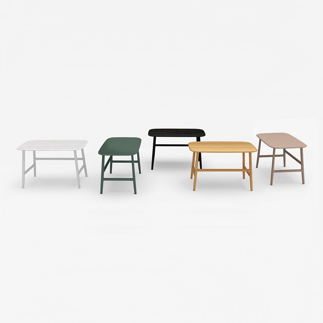 "Five stylish tables in white, green, black, yellow, and natural wood, showcasing modern colors and minimalist design."