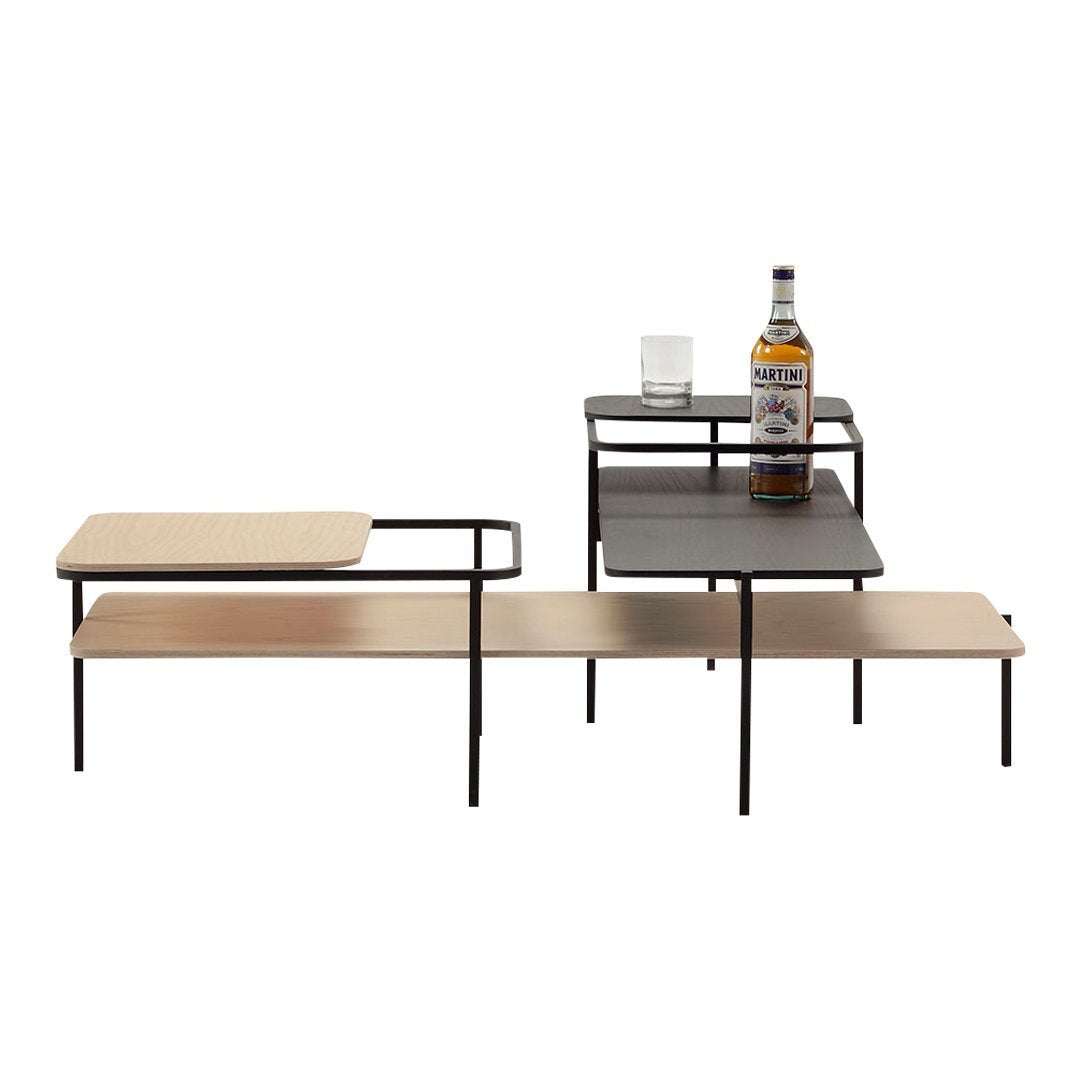 Stylish modern tabletop with natural wood and black metal accents, featuring geometric patterns and sleek lines.