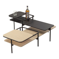Modern coffee table featuring a sleek black and natural wood finish with geometric layered design elements.