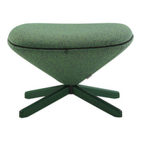 Green heart-shaped pouf with textured fabric pattern and dark green wooden base.