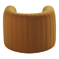 "Curved velvet stool in warm mustard yellow with elegant vertical ribbed pattern."