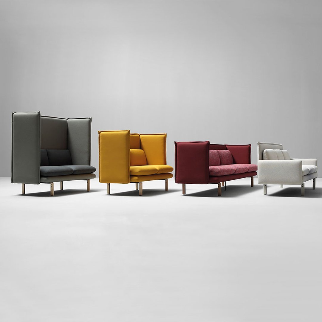 Colorful modern sofas in gray, yellow, red, and white with sleek patterns and minimalist design.