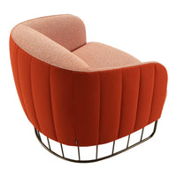 "Curved orange velvet chair with textured pink upholstery and metallic wire frame."