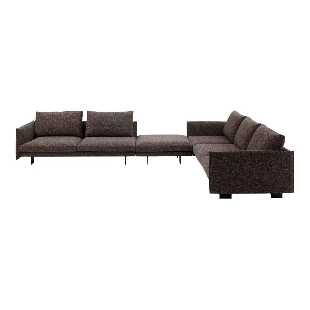 Dark brown sectional sofa with a modern design and soft textured fabric, perfect for contemporary living spaces.