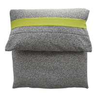 Gray patterned pillow with a vibrant lime green ribbon accent and textured design for a modern look.