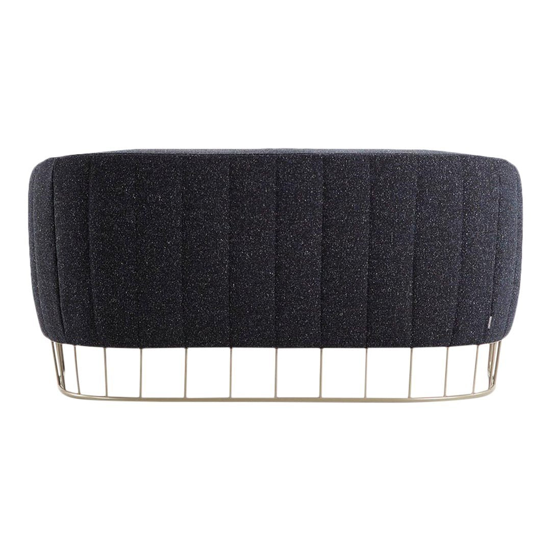 Black textured upholstery with vertical grooves and a gold wire base. Stylish and modern design for any space.