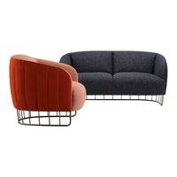 Elegant two-tone sofa and chair set in deep blue and warm coral with modern wireframe base. Perfect for stylish interiors.