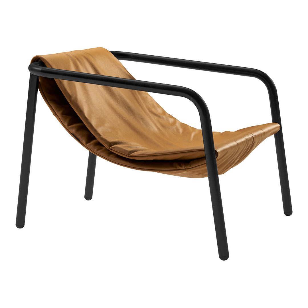 Tan leather lounge chair with black metal frame, featuring a sleek, minimalist design. Perfect for modern interiors.
