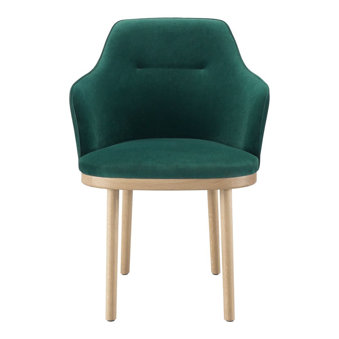 Green velvet chair with a smooth finish and natural wooden legs, featuring a modern, minimalist design.