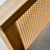 Close-up of a woven orange pattern against a textured brown backdrop, enhancing modern design aesthetics.