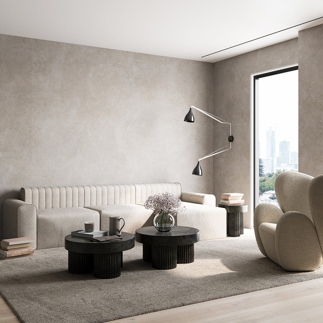 Modern living room featuring neutral grey tones and subtle textured patterns in furniture and decor.