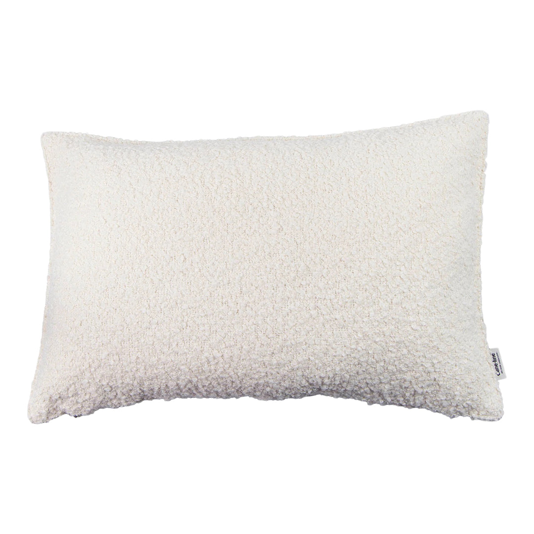Textured white pillow with a soft, fluffy surface, perfect for adding a cozy touch to any decor.