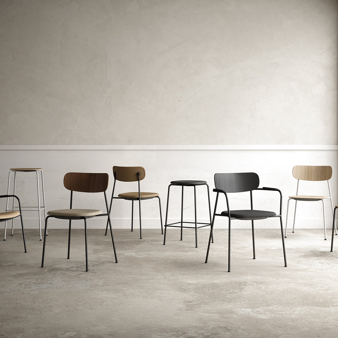 Various modern chairs in wood and metal, featuring brown, black, and beige colors against a minimalist background.