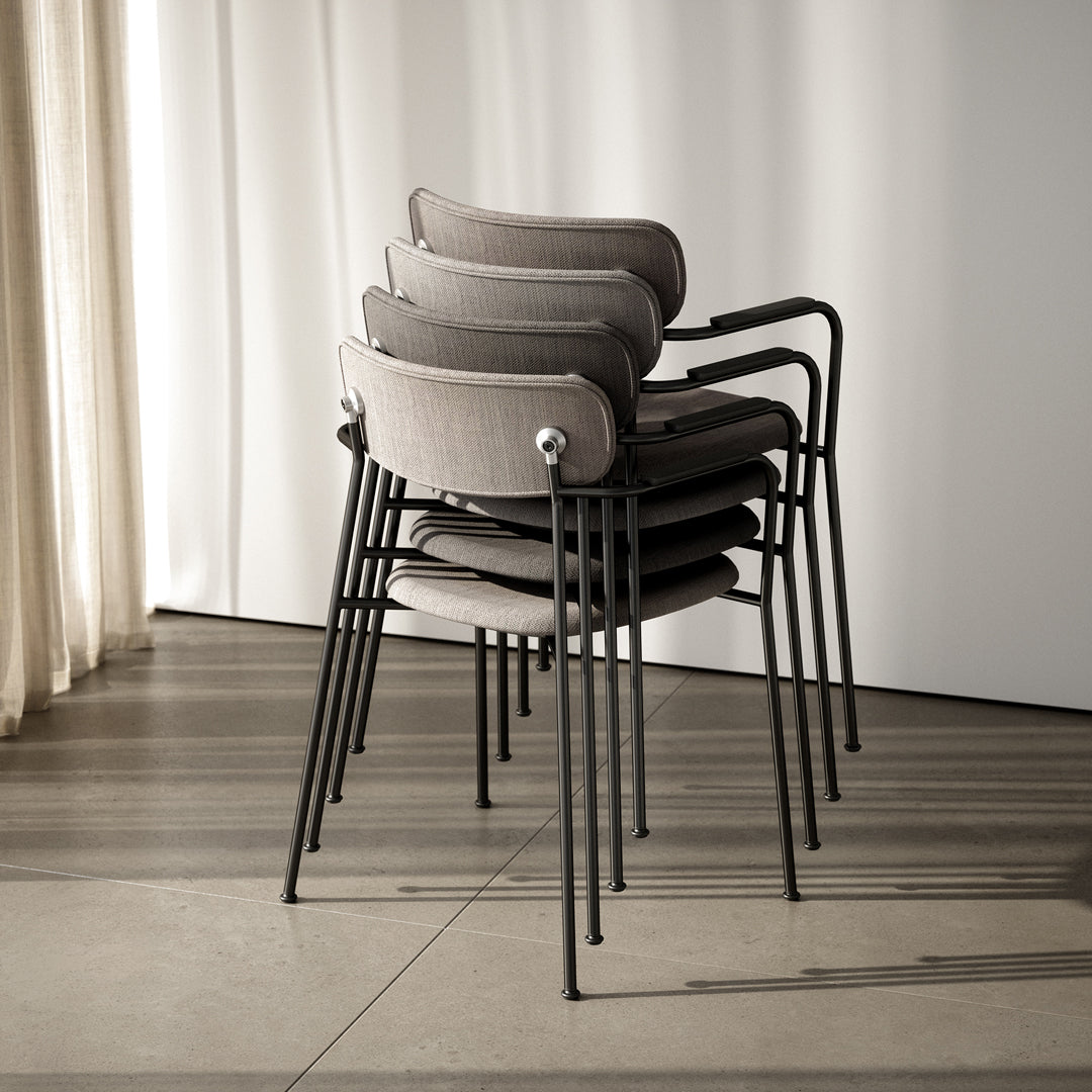 Stacked gray chairs with sleek black metal legs against a light background, showcasing a modern and minimalist design.