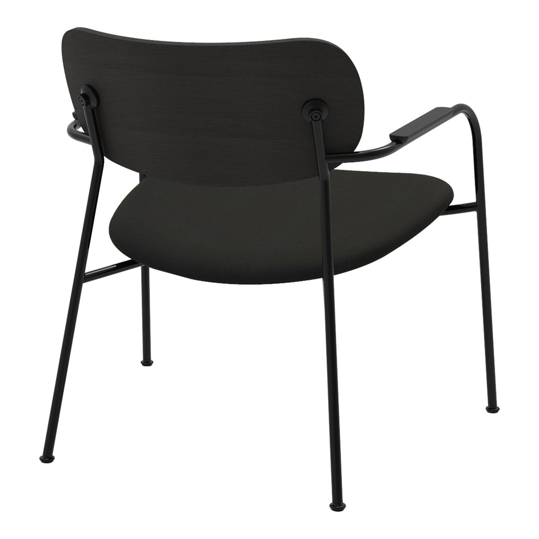 Black curved chair with minimalist design and sleek metal legs, featuring a smooth matte surface.