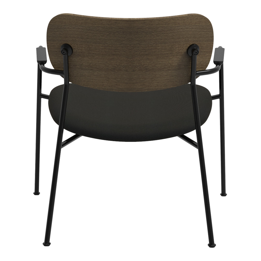 Modern chair with a textured brown wooden backrest and sleek black seat, complemented by matte black metal legs.