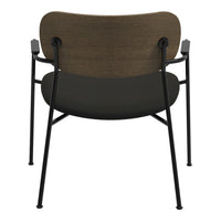Modern chair with a textured brown wooden backrest and sleek black seat, complemented by matte black metal legs.