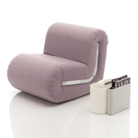 Modern lavender chair with rounded design and textured fabric, paired with a sleek, minimalist white magazine holder.