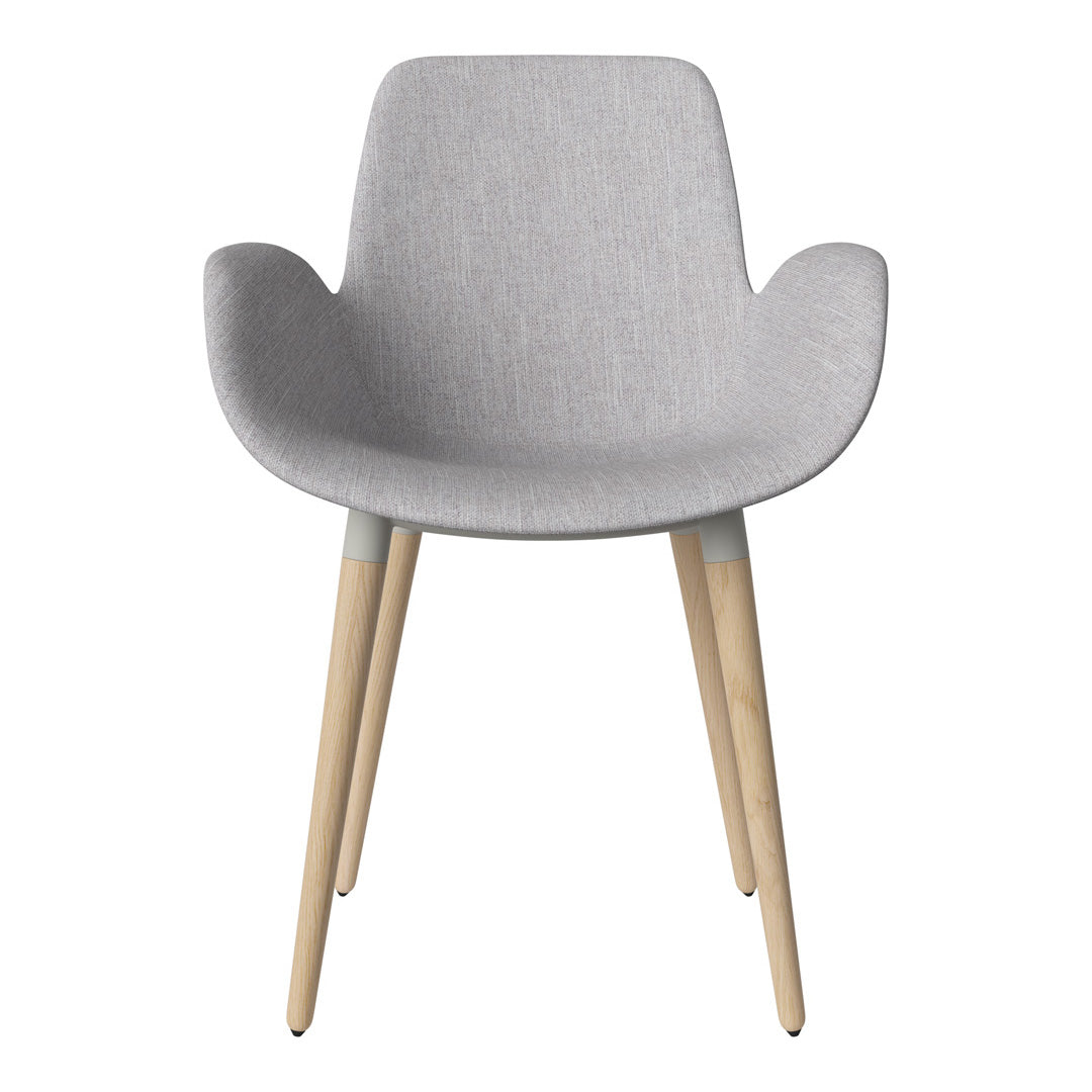 Light gray fabric armchair with natural wood legs, featuring a soft, textured pattern for a modern look.